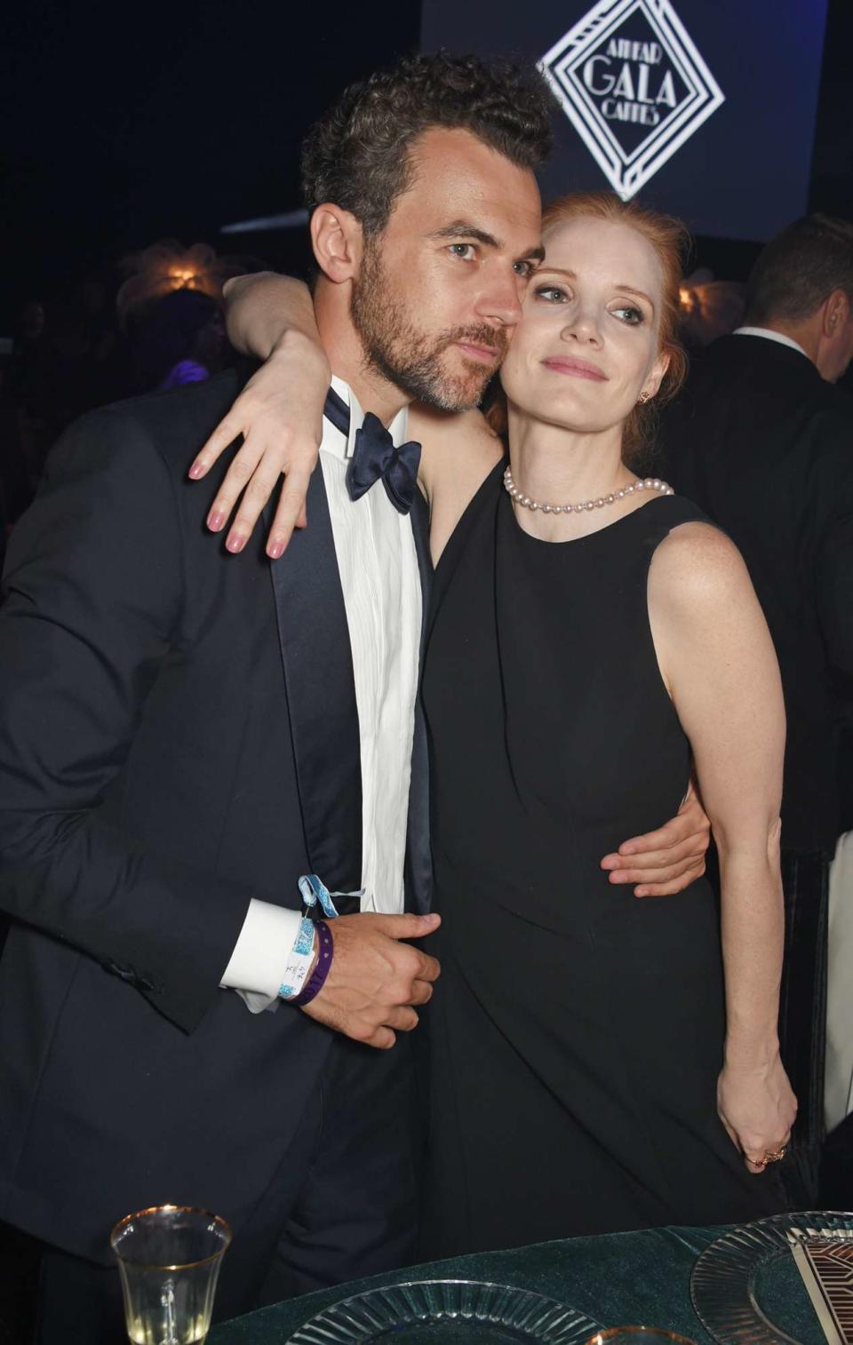 Gian Luca Passi de Preposulo (L) and Jessica Chastain attend the amfAR Gala Cannes 2017 at Hotel du Cap-Eden-Roc on May 25, 2017 in Cap d'Antibes, France