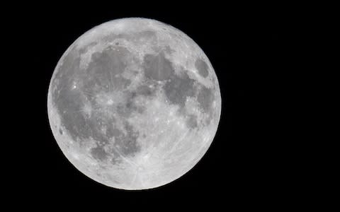 The full Harvest moon rises over Somerset - Credit: Matt Cardy/Getty Images