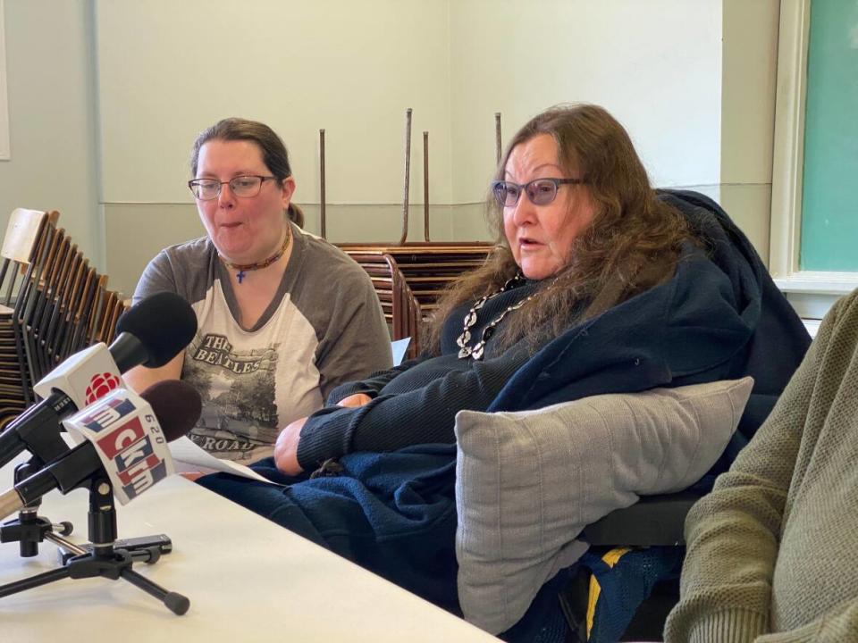 Terri Sleeva, right, a member of the Regina Citizens Public Transit Coalition, speaks at a press conference on March 31, 2023.  (Matt Howard/CBC - image credit)