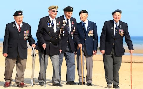 Len Fox, second from the left, sang part of We'll Meet Again at the Arromanches service - Credit: Jonathan Brady/PA