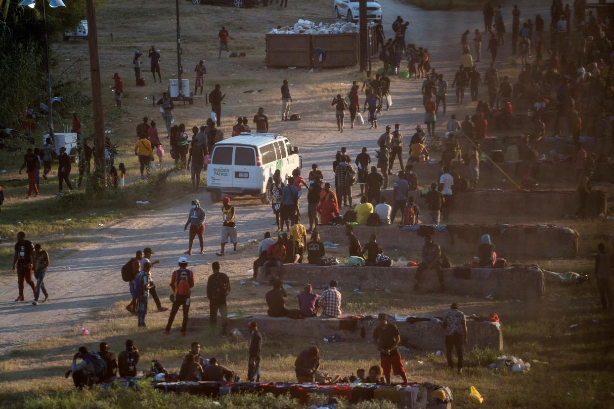 Migrants seeking asylum in the U.S. rest near the International Bridge between Mexico and the U.S. as they wait to be processed, in Del Rio, Texas (REUTERS)