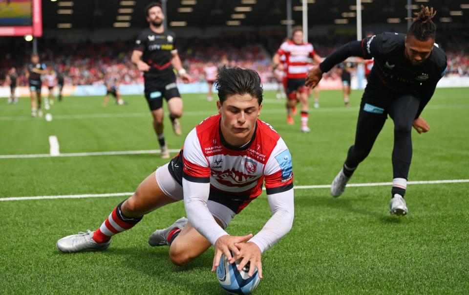 Louis Rees-Zammit of Gloucester Rugby touches down for the seventh try during the Gallagher Premiership Rugby match between Gloucester Rugby and Saracens at Kingsholm Stadium on June 04, 2022 in Gloucester, England. - GETTY IMAGES