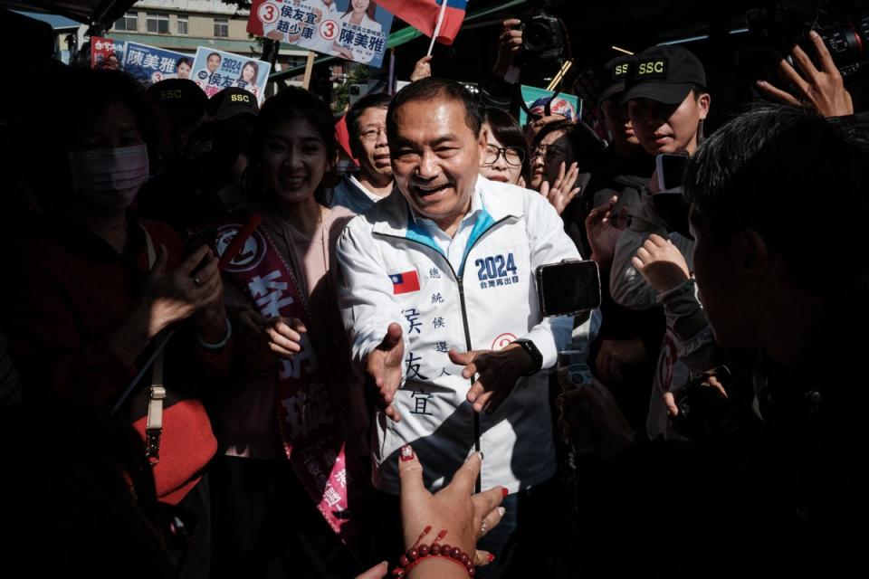 Hou Yu-ih visiting a market during a Taiwan election campaign visit in Kaohsiung on Wednesday (AFP/Getty)