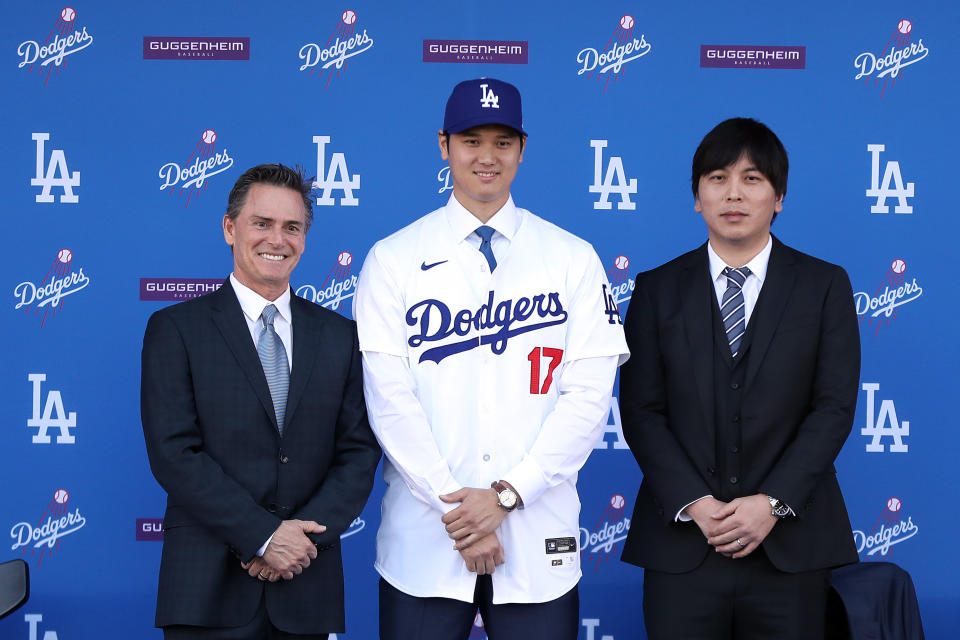 Shohei Ohtani with his interpreter Ippei Mizuhara (R) and agent Nez Balelo. (Meg Oliphant/Getty Images)