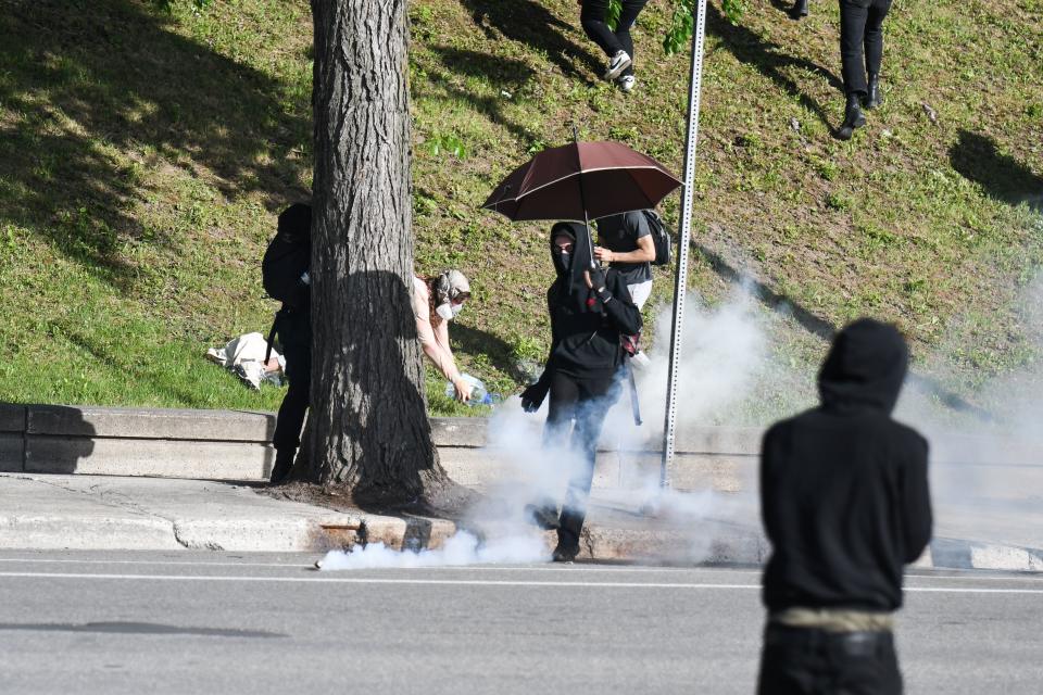 Montreal Police uses tear gas during a march against police brutality and racism in Montreal, Canada, on June 7, 2020. - On May 25, 2020, Floyd, a 46-year-old black man suspected of passing a counterfeit $20 bill, died in Minneapolis after Derek Chauvin, a white police officer, pressed his knee to Floyd's neck for almost nine minutes. (Photo by MARTIN OUELLET-DIOTTE / AFP) (Photo by MARTIN OUELLET-DIOTTE/AFP via Getty Images)