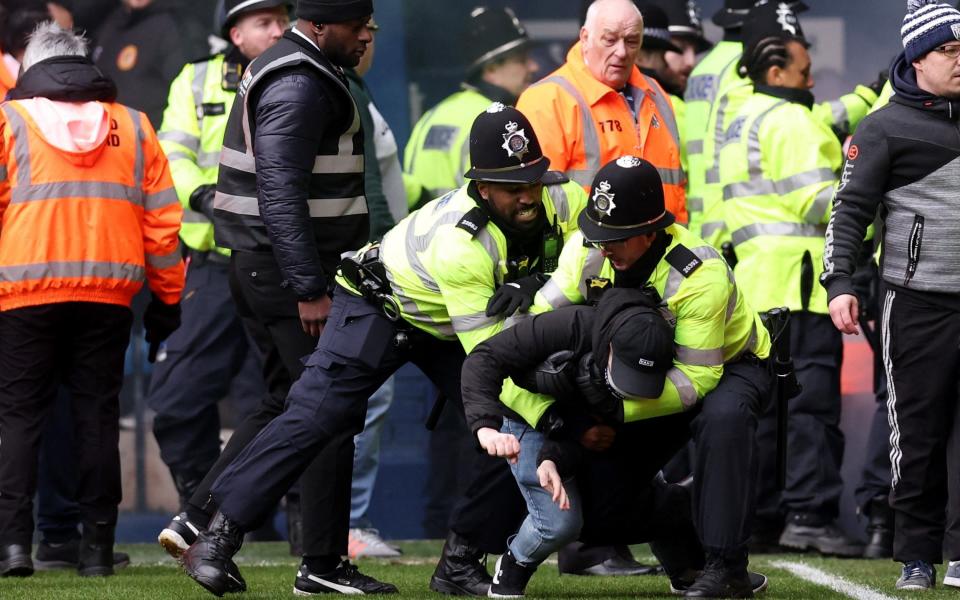 West Brom v Wolves crowd trouble: police use batons as players are called off the pitch