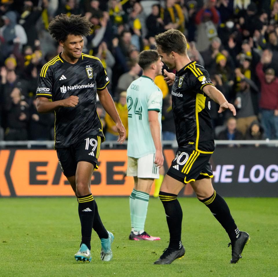 Mar 25, 2023; Columbus, Ohio, USA; Columbus Crew forward Jacen Russell-Rowe (19) celebrates with Columbus Crew defender Will Sands (30) after scoring a goal against Atlanta United during the second half of their MLS game at Lower.com Stadium. 