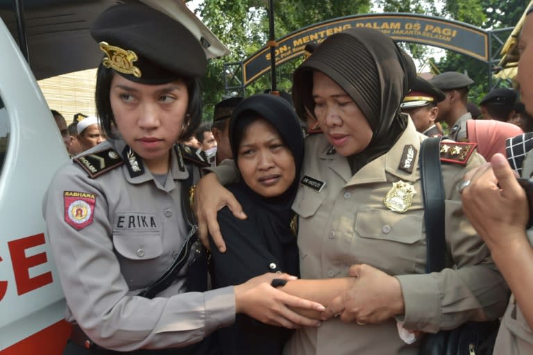 Relatives and colleagues of the policemen killed attended a memorial ceremony in Jakarta on Thursday