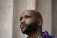 Brown University graduate Jason Carroll, a Maryland native whose ancestors were slaves in the Carolinas, stands for a portrait on the Brown campus in Providence, R.I., on Tuesday, May 4, 2021. Nearly two decades after launching its much-lauded reckoning with slavery, Brown hasn't taken any meaningful steps to compensate slave descendants themselves, argues Carroll. (AP Photo/Steven Senne)