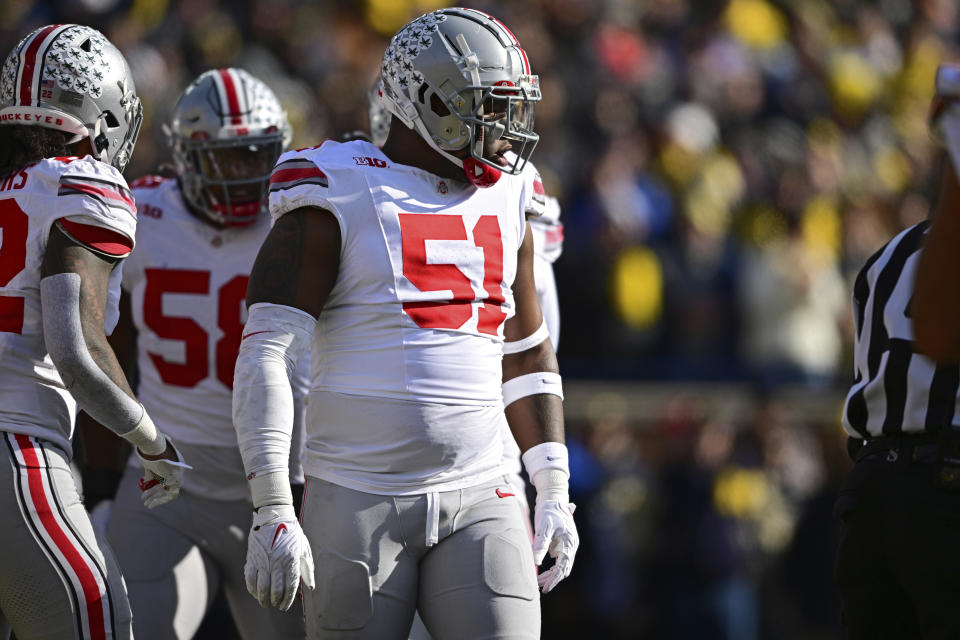 FILE - Ohio State defensive tackle Michael Hall Jr. (51) lines up during the first half of an NCAA college football game against Michigan, Nov. 25, 2023, in Ann Arbor, Mich. Browns draft picks Zak Zinter and Hall share an interesting past. Fierce rivals in college, they are connected by a play in last year's Ohio State-Michigan game when Hall got blocked into Zinter and accidentally broke his left leg. Now they are teammates in Cleveland. (AP Photo/David Dermer, File)