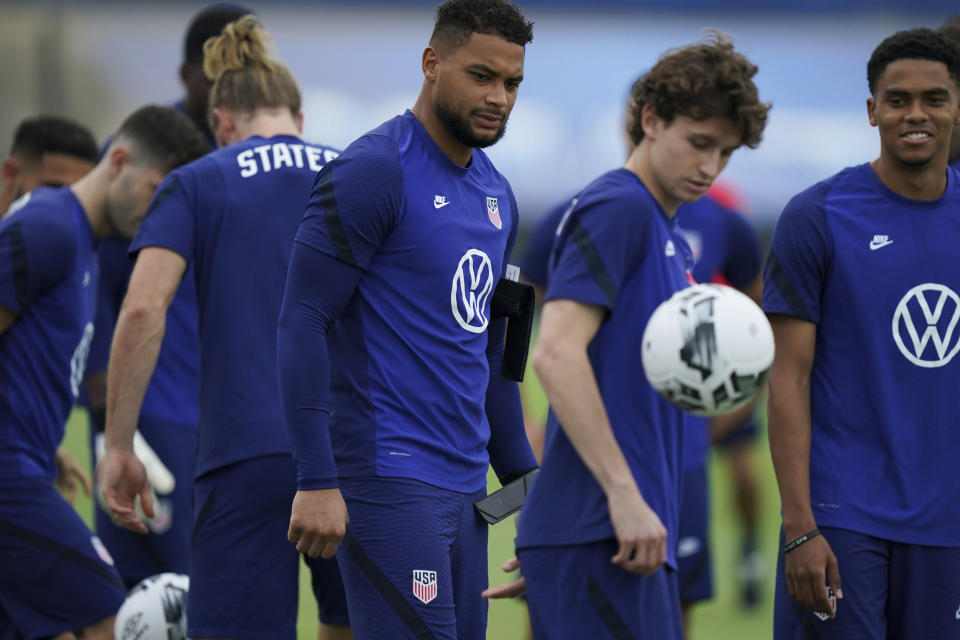 United States' goalkeeper Zack Steffen, center, eyes the ball during a training session ahead of the World Cup 2022 qualifying soccer match against Jamaica in Kingston, Monday, Nov. 15, 2021.(AP Photo/Fernando Llano)