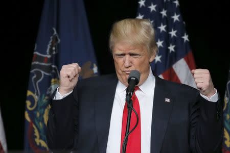 Republican U.S. presidential candidate Donald Trump reacts as he arrives at a campaign event in Harrisburg, Pennsylvania, U.S., April 21, 2016. REUTERS/Carlos Barria