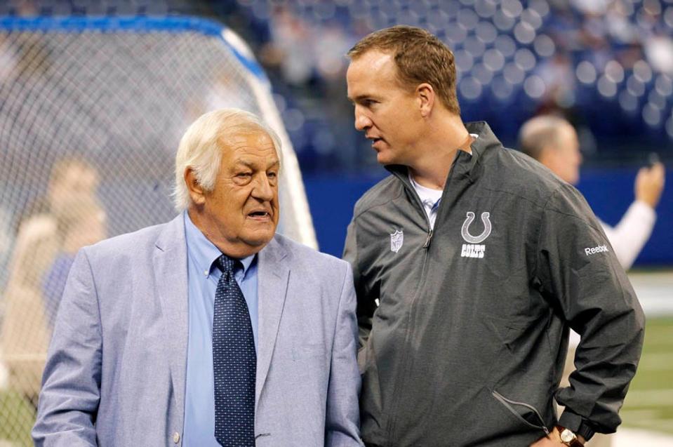 Colts quarterback Peyton Manning, right, talks with former Colts coach Tom Moore before a game against the Jacksonville Jaguars, Sunday, Nov. 13, 2011, in Indianapolis.