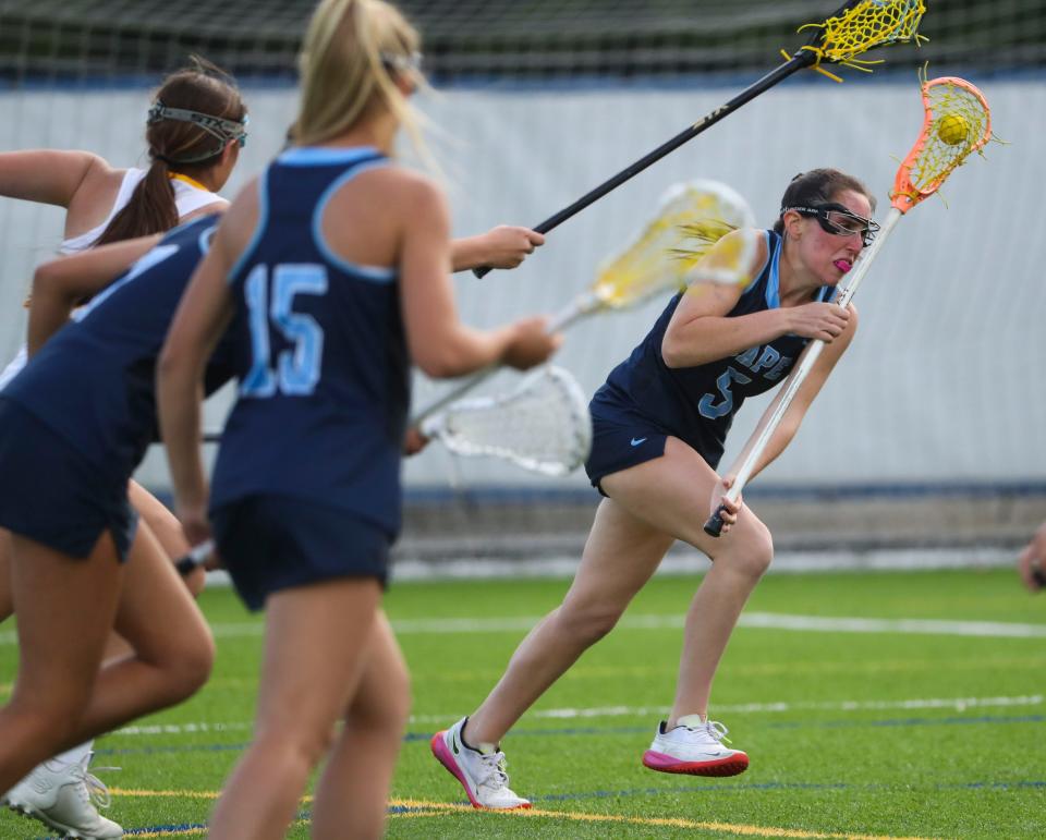 Cape Henlopen's Claire Lopez drives to the Riders' net in the second half of Cape Henlopen's 17-6 win at Caesar Rodney, Wednesday, April 26, 2023.