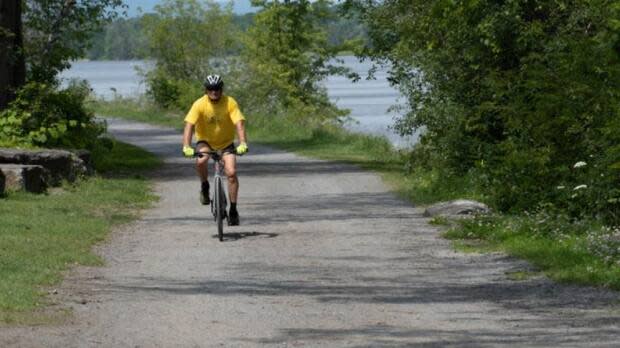 Cyclists take the multi-use pathway along the Ottawa River east of the capital's downtown earlier this month. (Jean Delisle/CBC - image credit)