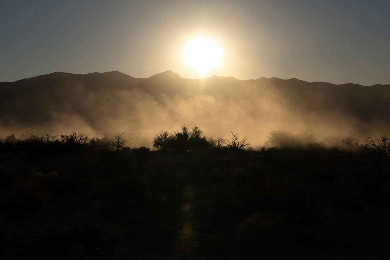 Dust settles after an off-road vehicle travels across federal land where the proposed Rough Hat solar project could be constructed in Pahrump, Nev., on Nov. 27, 2021. (Bridget Bennett for NBC News)