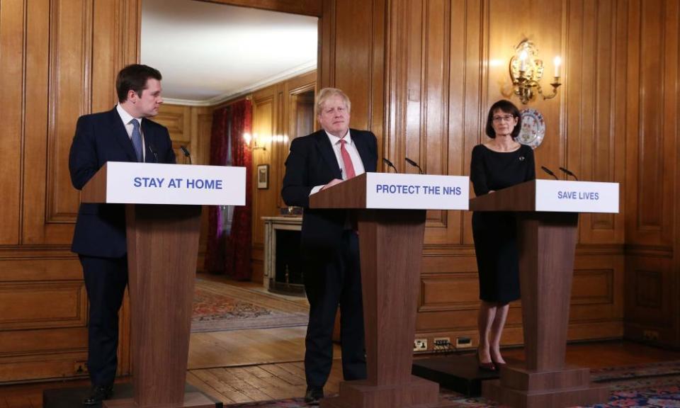 Robert Jernick, Boris Johnson and Jenny Harries give a press briefing at Downing Street on 22 March.