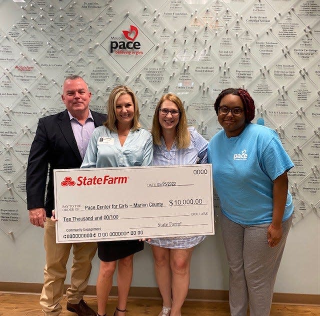 State Farm Agent Angie Lewis, second from left, donated her $10,000 company award to Pace Center for Girls.