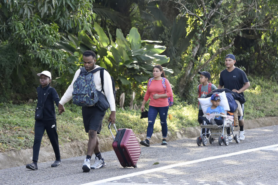 Migrants walk along a highway in Huixtla, Mexico, Monday, Dec. 25, 2023. A caravan of migrants set out north through southern Mexico just days before U.S. Secretary of State Antony Blinken arrives in Mexico City to discuss new agreements to control the surge of migrants seeking entry into the United States. (AP Photo/Edgar H. Clemente)