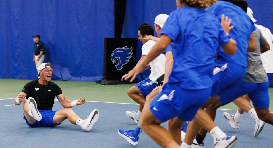 Millen Hurrion’s teammates run up to him in celebration after Hurrion won his singles match to clinch last weekend’s NCAA Sweet 16 victory over Wake Forest at UK.