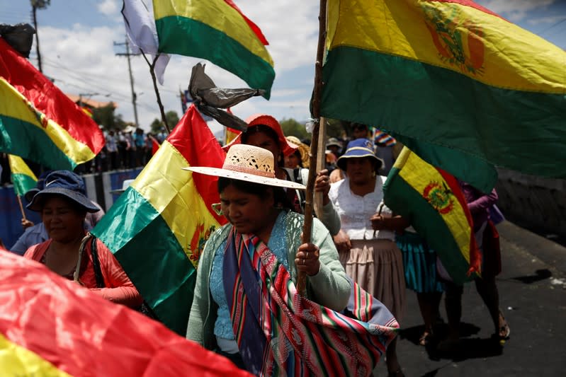 Coca farmers and supporters of Bolivia's ousted President Evo Morales march as they stage a blockade of an entrance to Sacaba