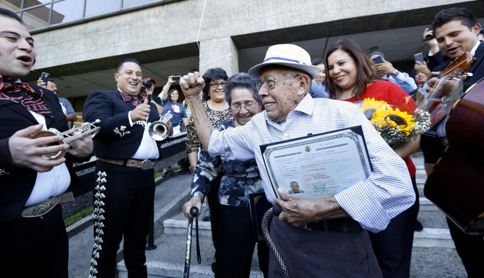 Fabio Alvarado, 91, originally from El Salvador and who was sworn in as a U.S. citizen on election day, arrives with his wife Marta, 80, to vote in the U.S. presidential election at LA County Registrar's office in Norwalk, California, on Nov.8.