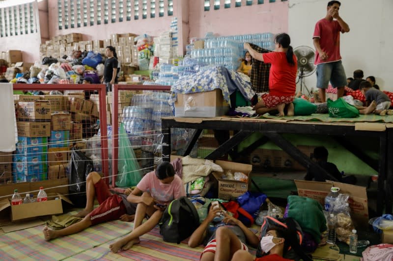 Residents affected by the Taal Volcano eruption rest in an evacuation center in Santo Tomas