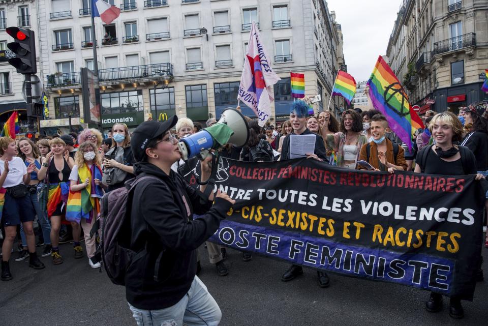 Young demonstrators dance at the start of the annual Gay Pride march in Paris, France, Saturday, July 4, 2020. (AP Photo/Benjamin Girette)