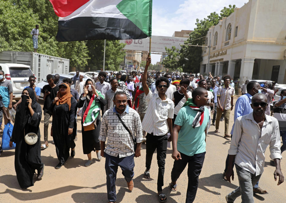 Sudanese protesters rally outside the Cabinet’s headquarters in the capital, Khartoum, Sudan, Monday, Aug. 17, 2020. The protesters returned to the streets Monday to pressure transitional authorities for more reforms, a year after a power-sharing deal between the pro-democracy movement and the generals. (AP Photo/Marwan Ali)