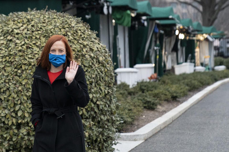 White House press secretary Jen Psaki waves after doing a television interview at the White House, Thursday, Jan. 21, 2021, in Washington. (AP Photo/Alex Brandon)