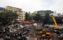 Rescue crews search for survivors at the site of a collapsed residential building in Mumbai September 27, 2013. (REUTERS/Danish Siddiqui)