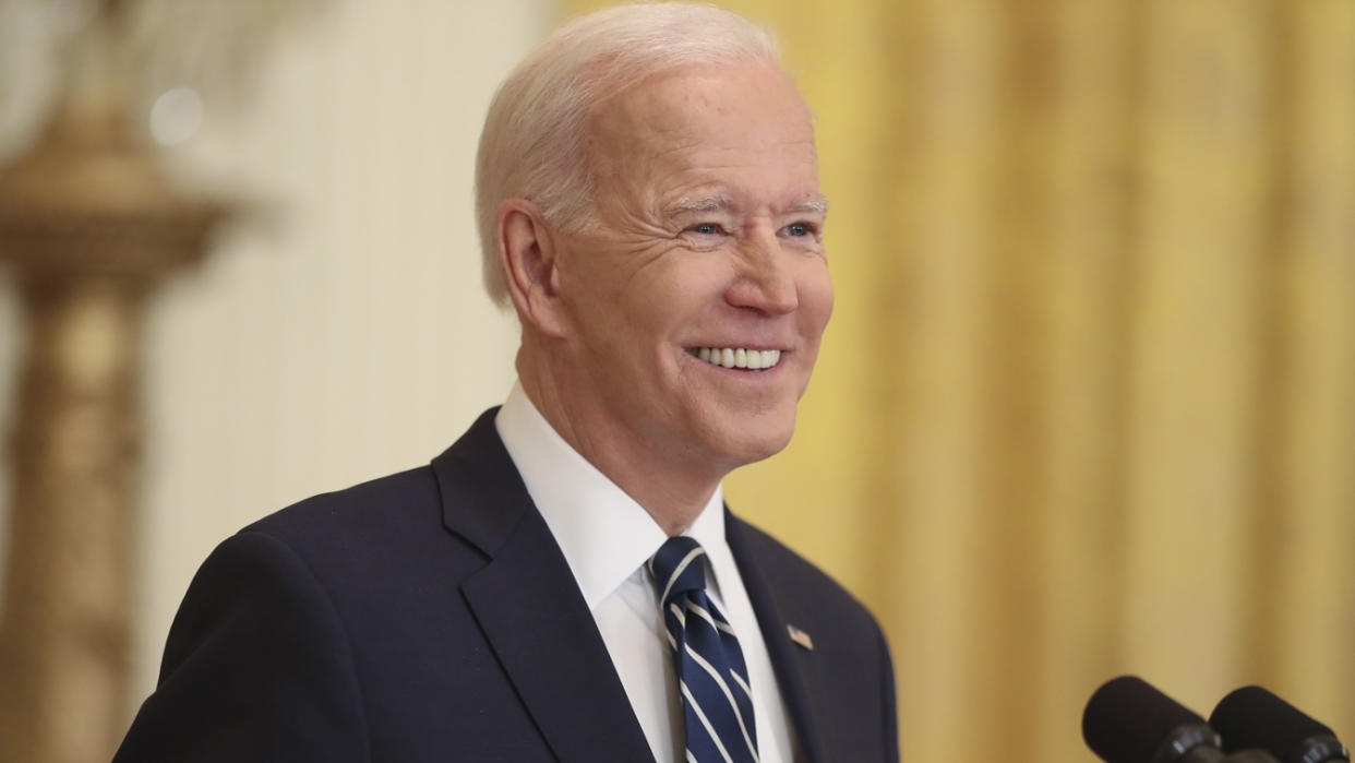 U.S. President Joe Biden smiles while speaking during a news conference in the East Room of the White House in Washington, D.C., U.S., on Thursday, March 25, 2021. (Oliver Contreras/Sipa/Bloomberg via Getty Images)