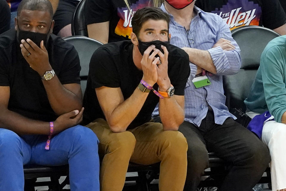 Former olympic swimmer Michael Phelps watches the Phoenix Suns and the Denver Nuggets 118during the first half of Game 2 of an NBA basketball second-round playoff series, Wednesday, June 9, 2021, in Phoenix. (AP Photo/Matt York)