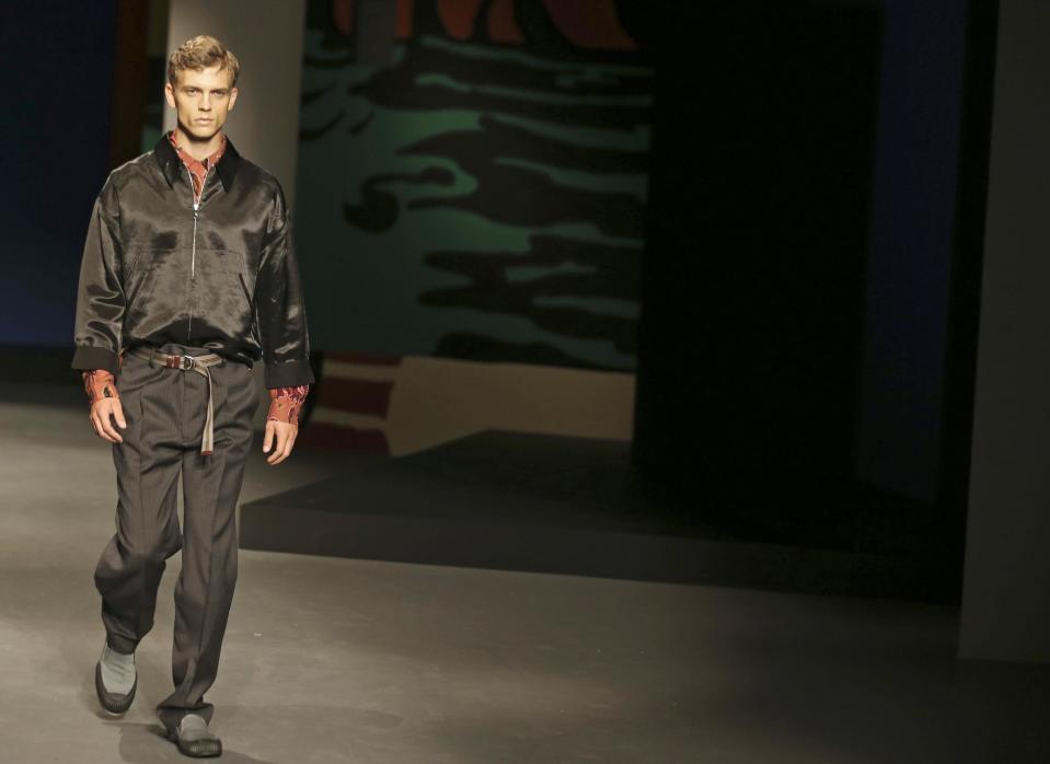 A model wears a creation for Prada men's Spring-Summer 2014 collection, part of the Milan Fashion Week, unveiled in Milan, Italy, Sunday, June 23, 2013. (AP Photo/Luca Bruno)