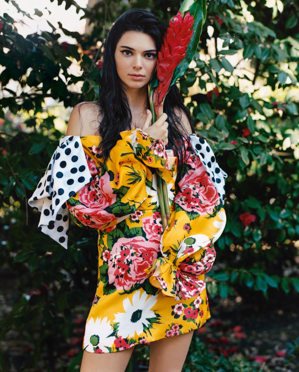 Jenner blooms in Carolina Herrera’s off-the-shoulder floral minidress with bow-tied sleeves, $3,990; Carolina Herrera, NYC.