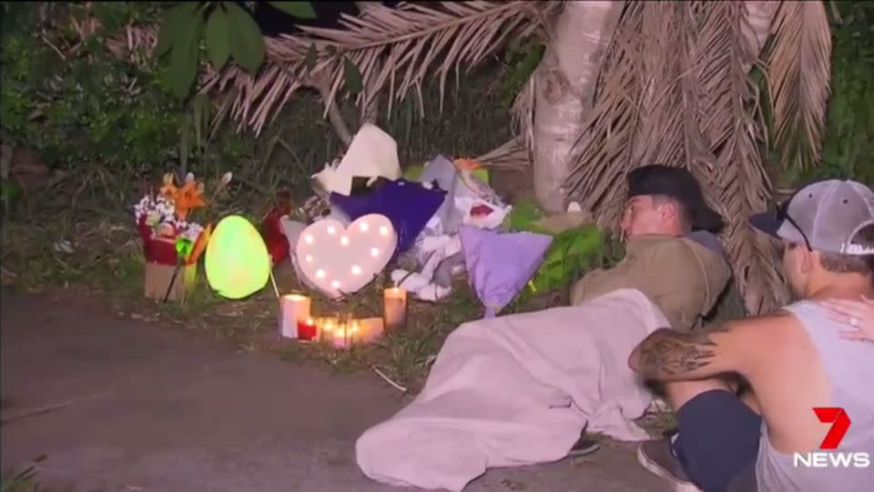 Mourners grieved outside the Sisson's residence leaving toys and flowers in Josiah's memory. have Source: 7 News