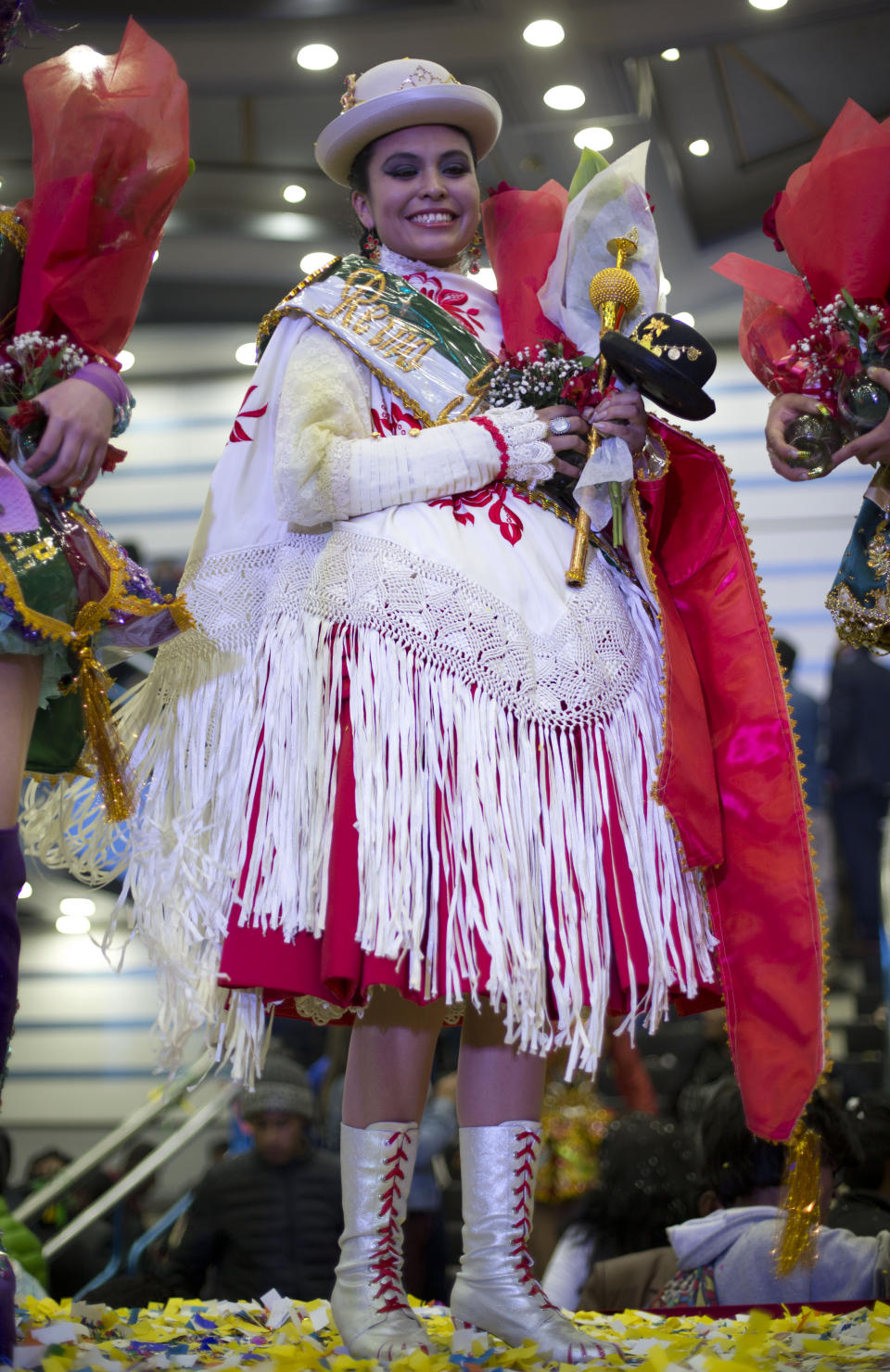 Contestant Steffany Arriaza Cabezas poses for photos after she was crowned Queen of Great Power, in La Paz, Bolivia, Friday, May 24, 2019. The largest religious festival in the Andes choses its queen in a tight contest to head the Festival of the Lord Jesus of the Great Power, mobilizing thousands of dancers and more than 4,000 musicians into the streets of La Paz. (AP Photo/Juan Karita)