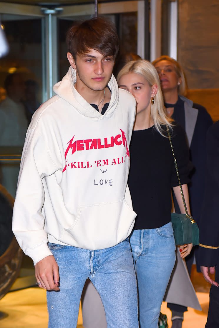 Anwar Hadid, with girlfriend Nicola Peltz, added some love to his sweatshirt. (Photo: Getty Images)