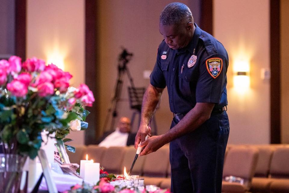 A police officer lights candles in honor of crime victims during a candlelight ceremony as a part of National Crime Victims’ Rights Week at First Baptist Church of Gulfport on Tuesday, April 23, 2024.