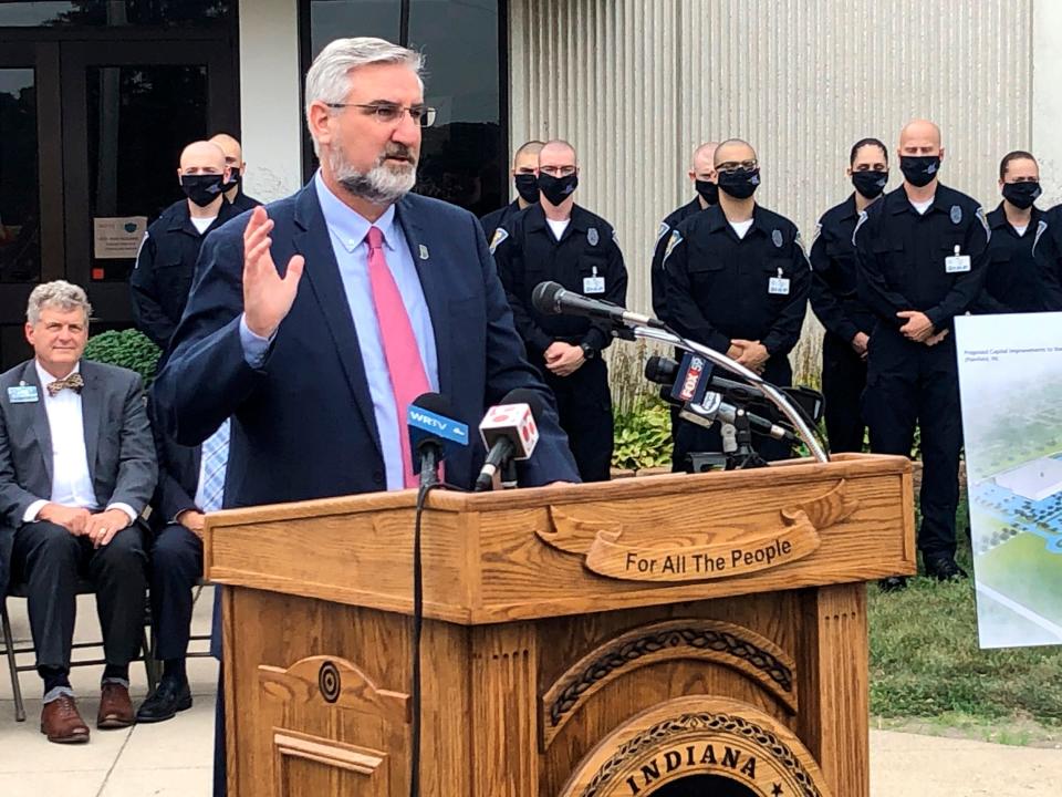 Indiana Gov. Eric Holcomb speaks during a bill signing ceremony at the Indiana Law Enforcement Academy in Plainfield, Ind., Monday, Aug. 16, 2021.