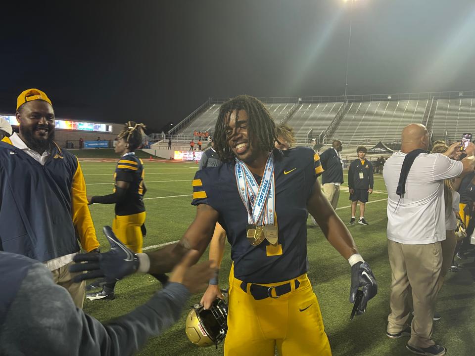St. Thomas Aquinas senior running back Jordan Lyle celebrates the Raiders 31-28 win against Homestead in the Class 3M state championship on Saturday at Bragg Memorial Stadium in Tallahassee.