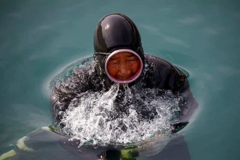 The Wider Image: For South Korea's youngest 'sea women', warming seas mean smaller catches