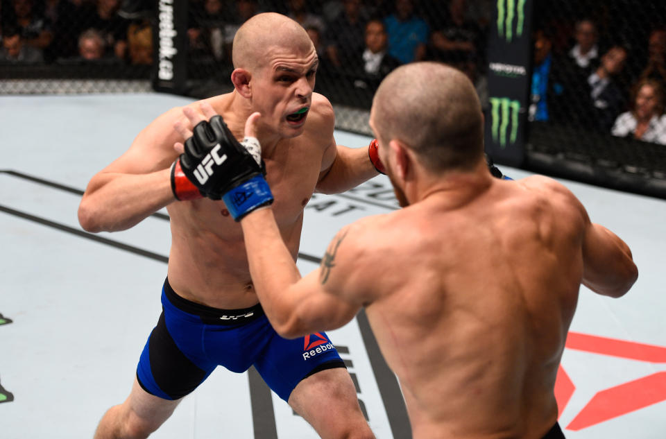 VANCOUVER, BC - AUGUST 27:  (L-R) Joe Lauzon of the United States punches Jim Miller of the United States in their lightweight bout during the UFC Fight Night event at Rogers Arena on August 27, 2016 in Vancouver, British Columbia, Canada. (Photo by Jeff Bottari/Zuffa LLC/Zuffa LLC via Getty Images)