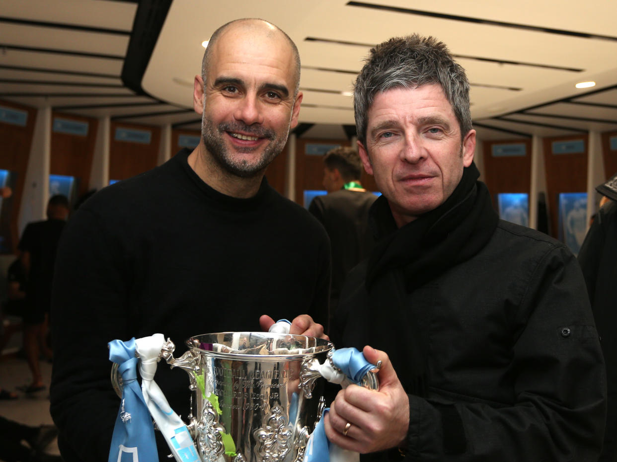 LONDON, ENGLAND - MARCH 01: Pep Guardiola, Manager of Manchester City and Noel Gallagher pose with the trophy following their sides victory in the Carabao Cup Final between Aston Villa and Manchester City at Wembley Stadium on March 01, 2020 in London, England. (Photo by Victoria Haydn/Manchester City FC via Getty Images)