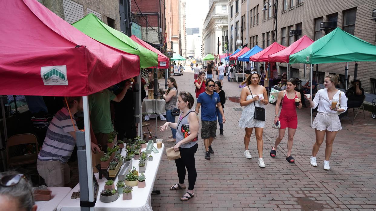 Shoppers stroll through the Pearl Market Downtown, the first event for the market this year.