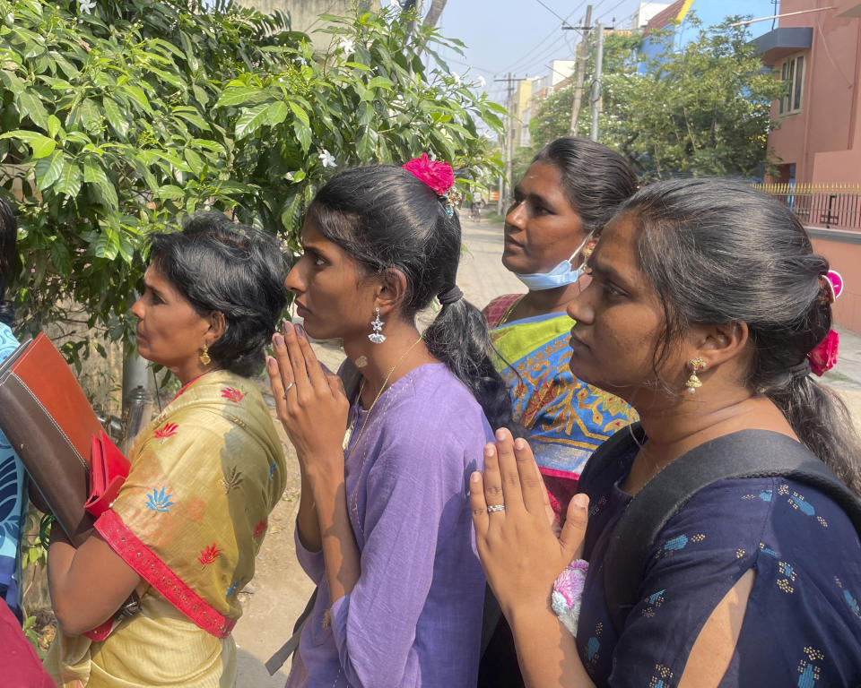 Visa seekers gather to pray at the Sri Lakshmi Visa Ganapathy Temple in Chennai, a city on the southern coast of India on Nov. 28, 2022. These "visa temples" can be found in almost any Indian city with a U.S. consulate. They have surged in popularity because of a belief popularized on social media that those who pray there will not just get their visa, but will enjoy a smooth, stress-free path to getting it. (AP Photo/Deepa Bharath)