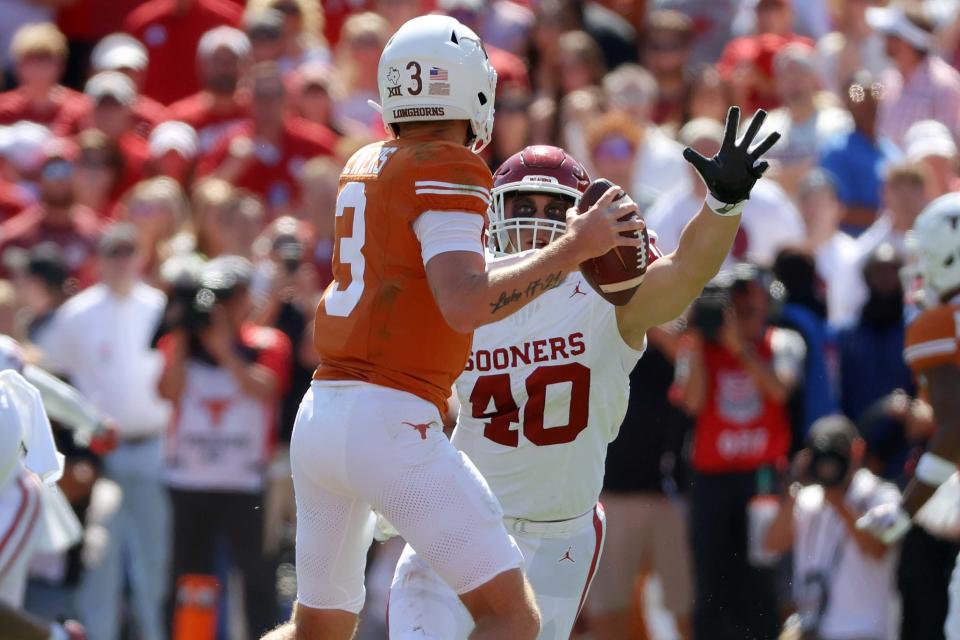 Oklahoma Sooners defensive lineman Ethan Downs (40) chases Texas Longhorns quarterback Quinn Ewers (3) during the Red River Rivalry college football game between the University of Oklahoma Sooners (OU) and the University Longhorns of Texas (UT) in the Cotton Bowl in Dallas, Saturday, October 7, 2023. Oklahoma won 34-30.