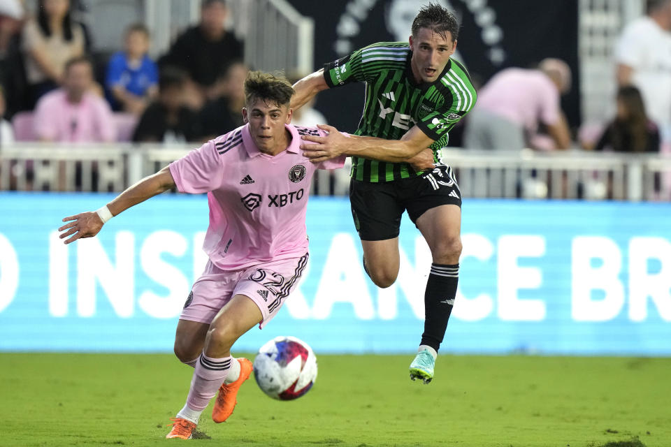 Inter Miami defender Noah Allen, left, runs with the ball as Austin FC midfielder Ethan Finlay, right, defends during the first half of an MLS soccer match, Saturday, July 1, 2023, in Fort Lauderdale, Fla. (AP Photo/Lynne Sladky)