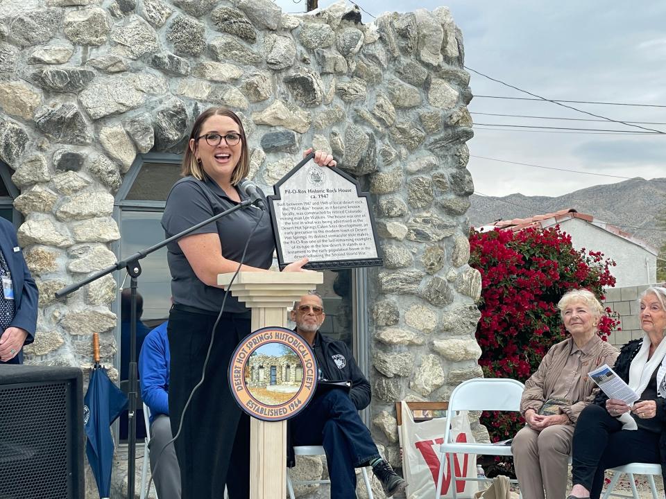 Bridget Lawler, historic preservation officer with the Riverside County Historic Commission, presents a plaque for the Historic Rock House on Saturday, Jan. 20, 2024.