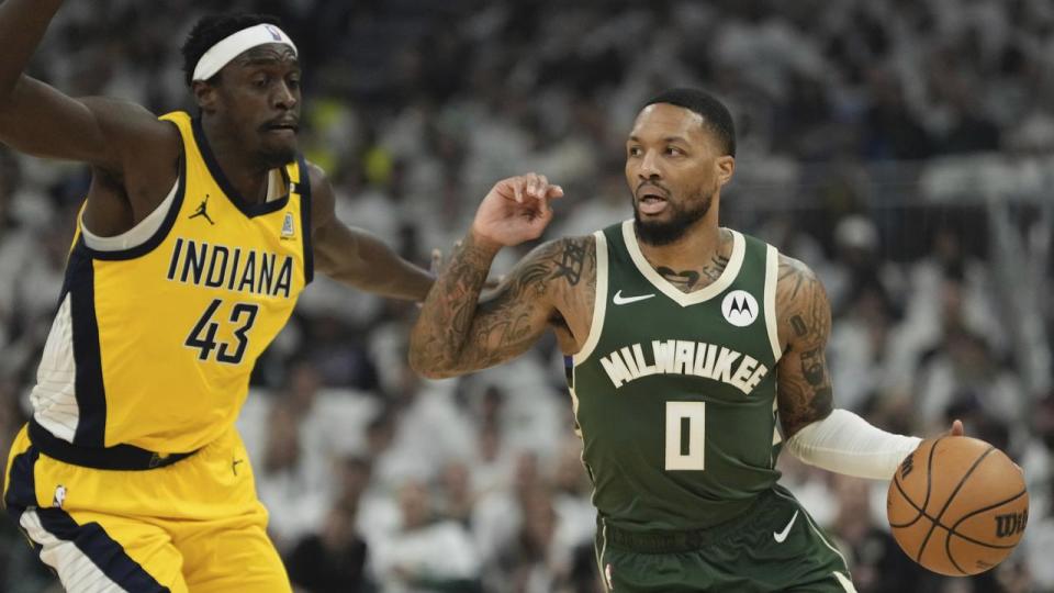 Damian Lillard (right) gets past Indiana Pacers' Pascal Siakam